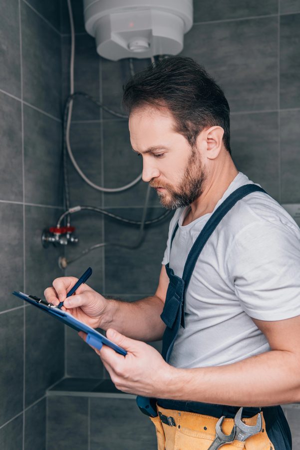 Plumber checking shower plumbing