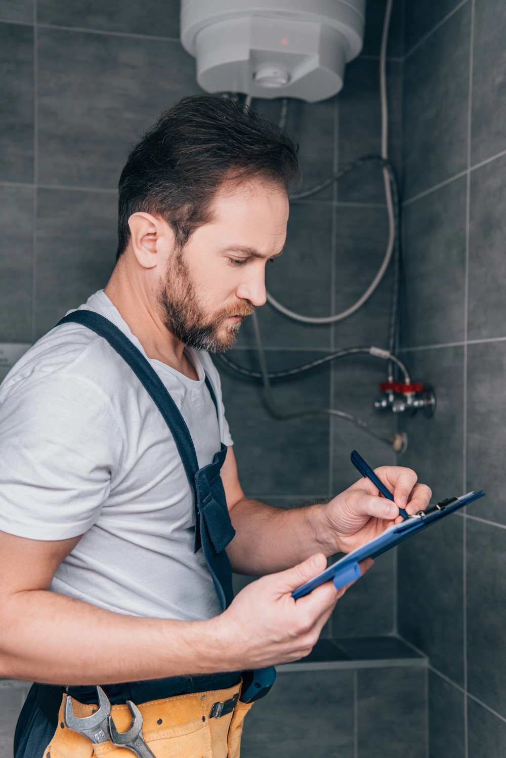 Barryway Plumbing professional checking plumbing in a bathroom